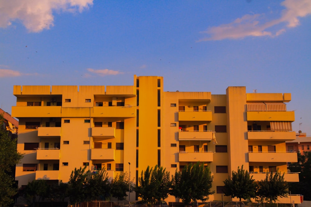 a large building with trees in front of it