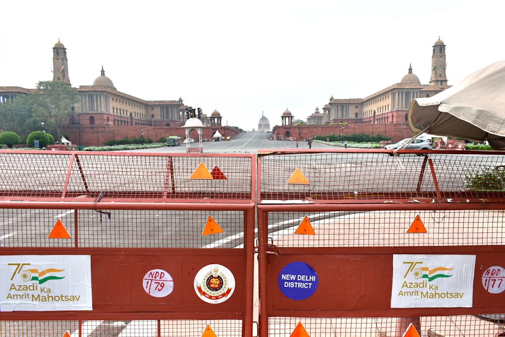 a fence with orange flags