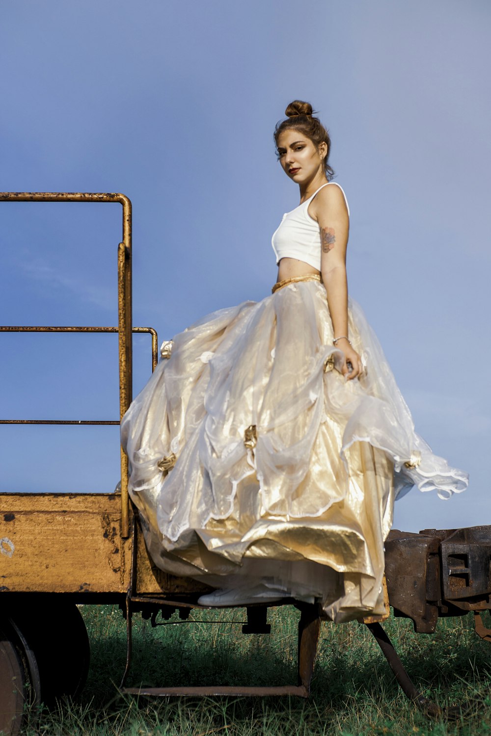 a person in a white dress on a trailer