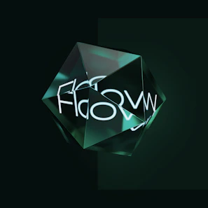 A geometric glass-like structure with multiple facets sits against a dark background. The structure reflects light and creates a glowing effect. The word 'Flow' is visible and may be reflected or refracted through the facets.