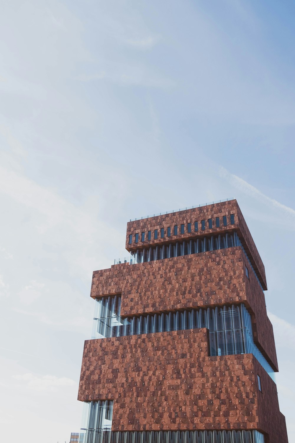 a tall building with a blue sky