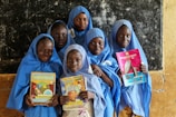 a group of women holding books
