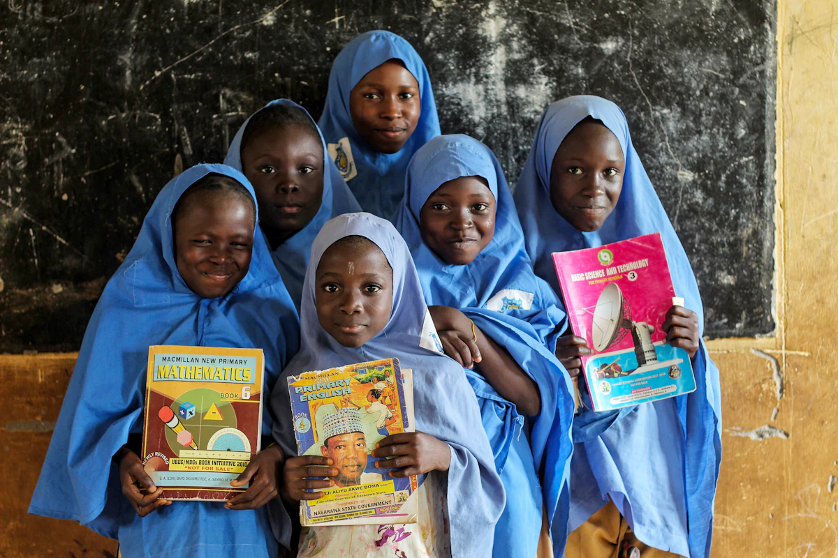 A group of students standing together with their books after a session