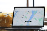 a laptop with a map on the screen