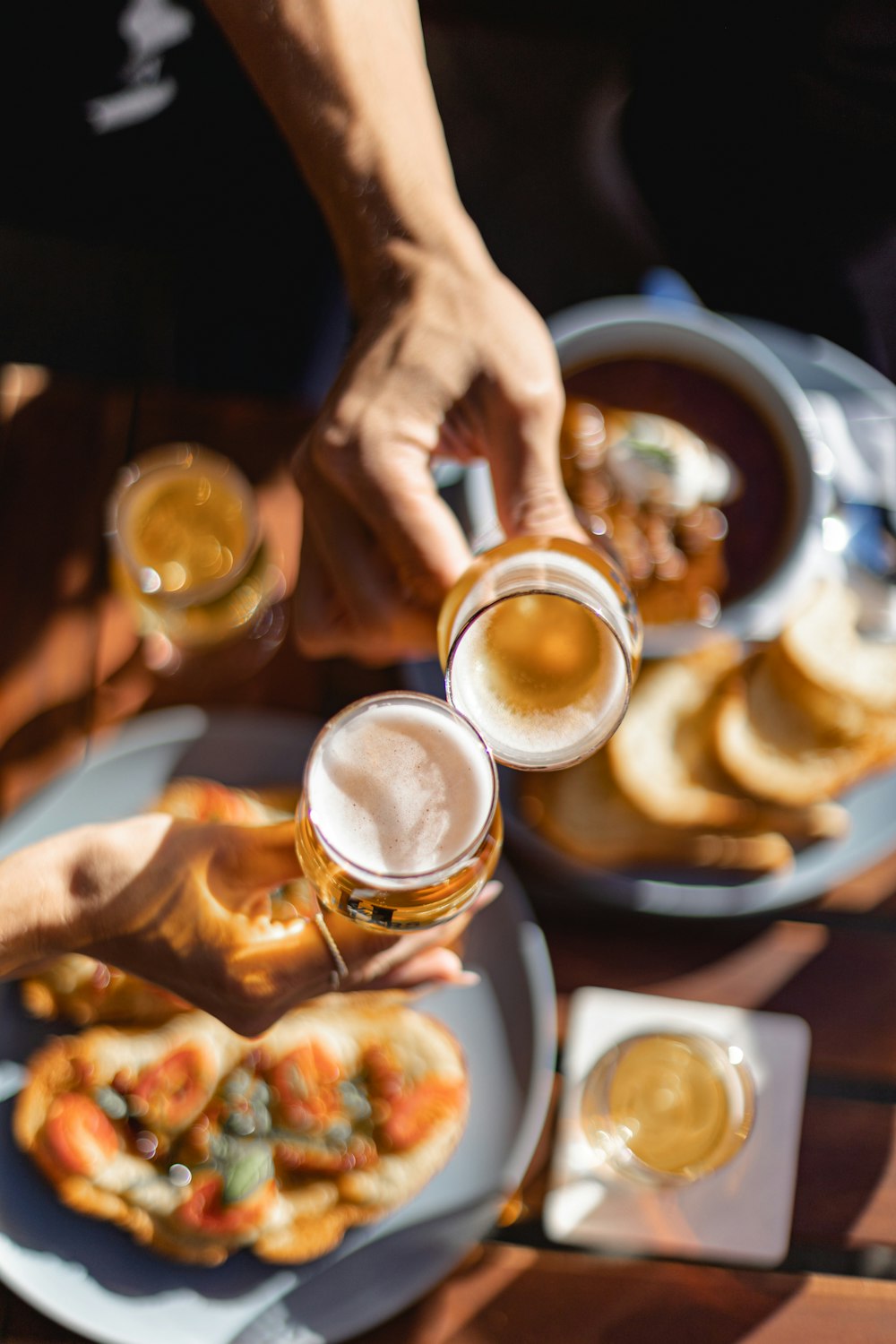 a person holding a glass of beer