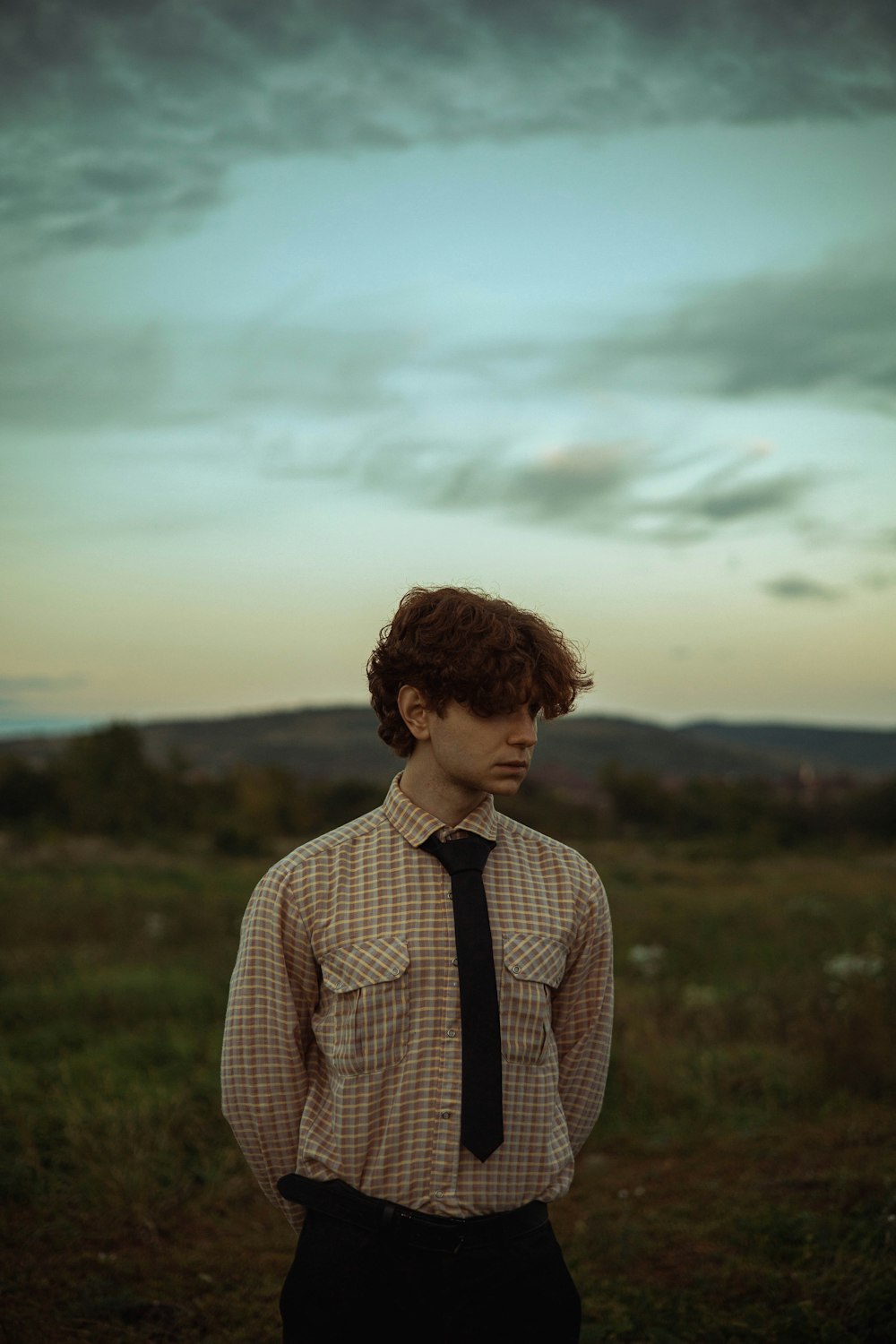 a man in a tie and shirt