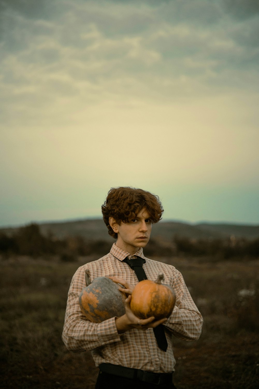 a boy holding an apple