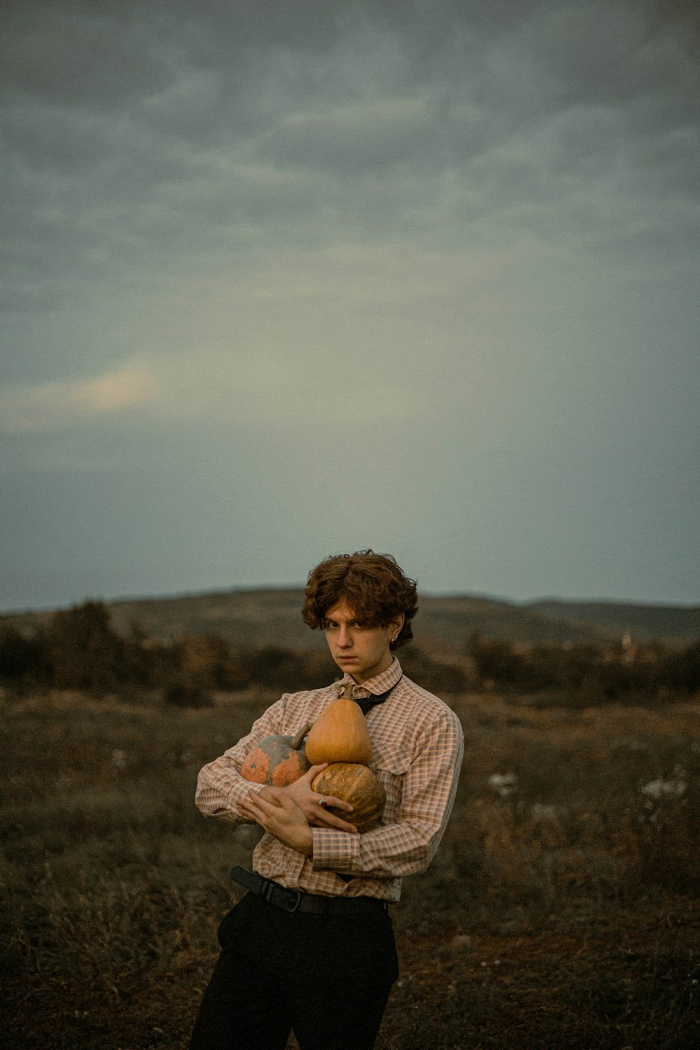 a boy holding a stuffed animal