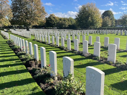 A Commonwealth war cemetery, its headstones in rows — Bayeux, France