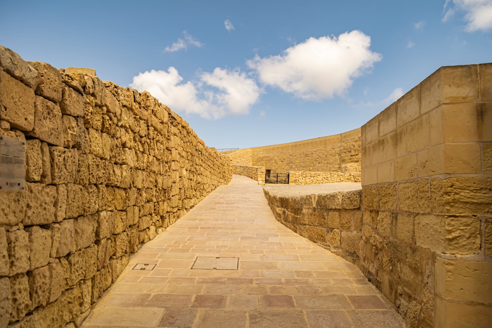 a stone wall with a stone walkway