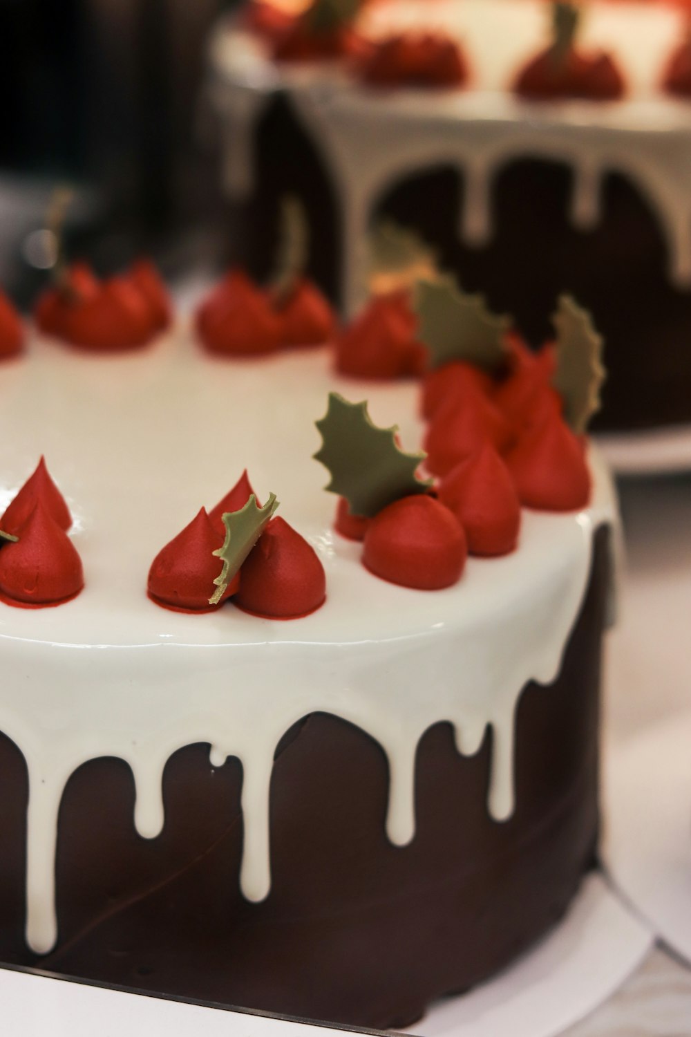a cake with red berries on top