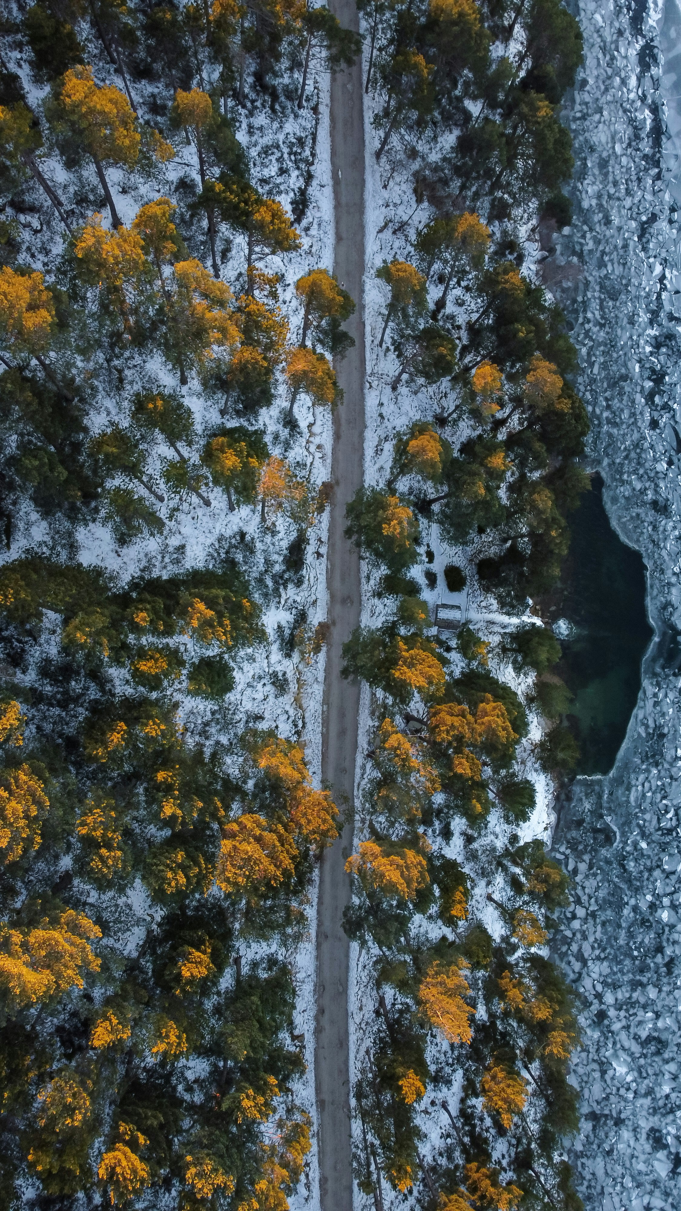 A mountain road in Andorra in the middle of winter from a drone's point of view