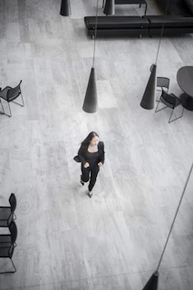 a person walking on a wooden floor