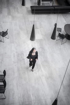 a person walking on a wooden floor