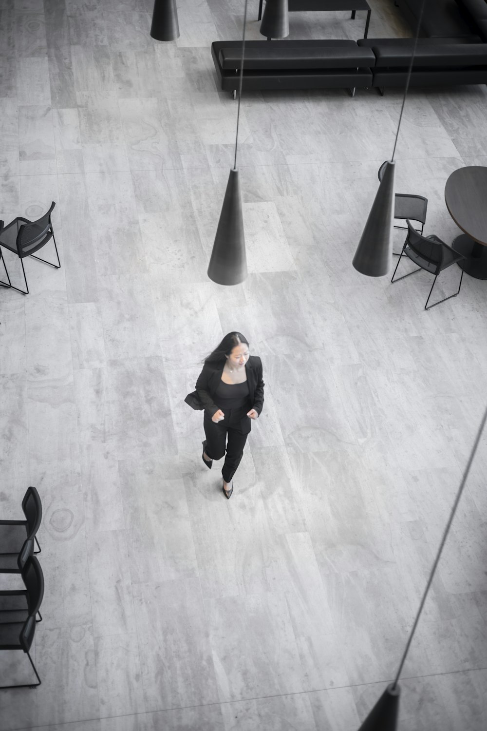 a person walking on a wooden floor