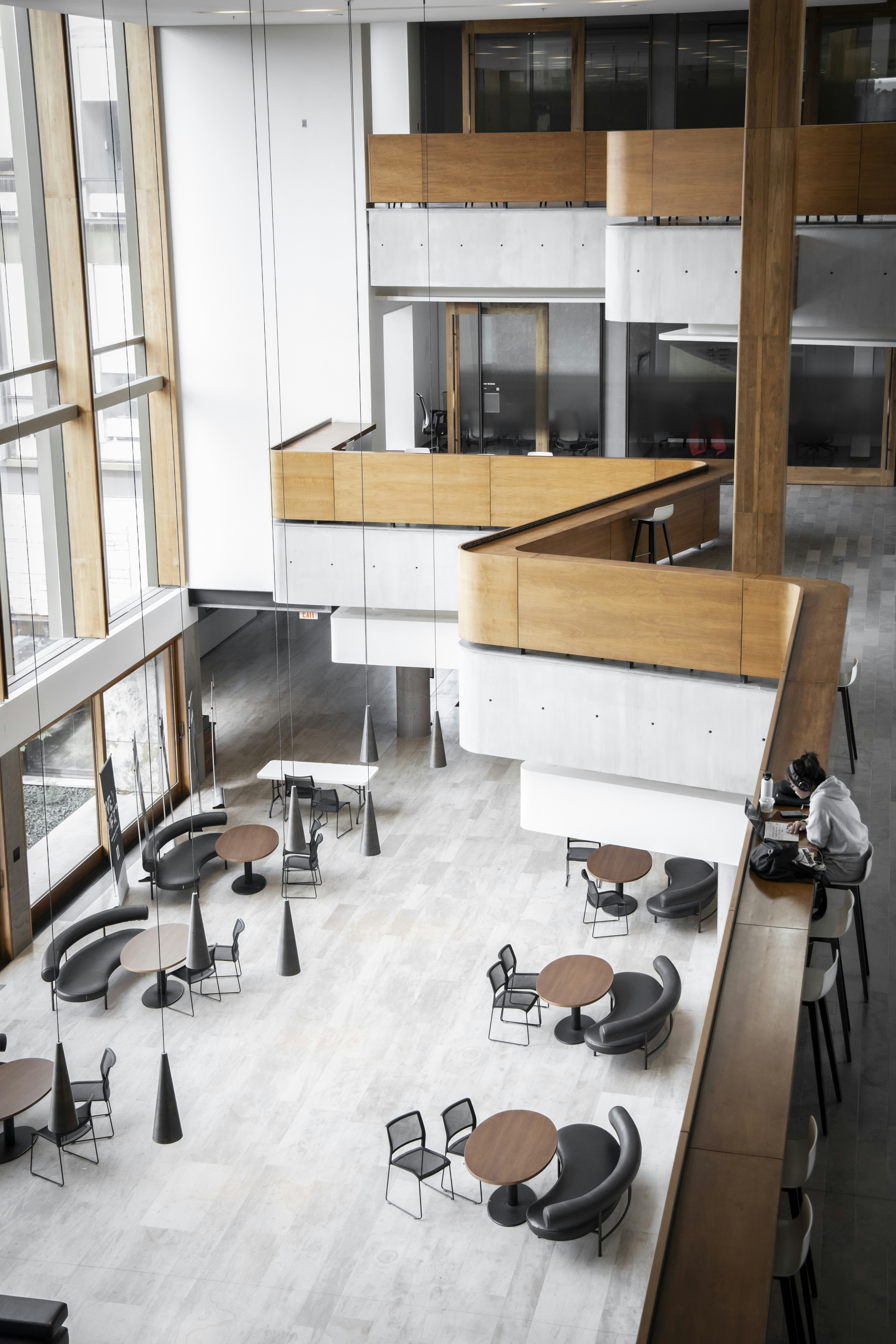 woman wearing yellow long-sleeved dress under white clouds and blue sky during daytime