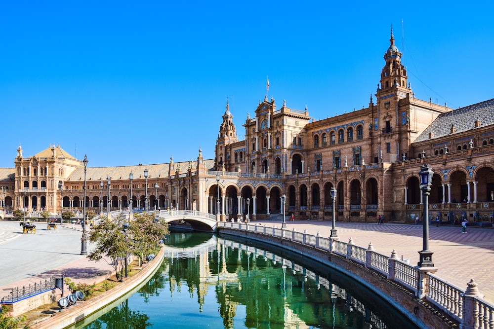 a large building with a pool in front of it