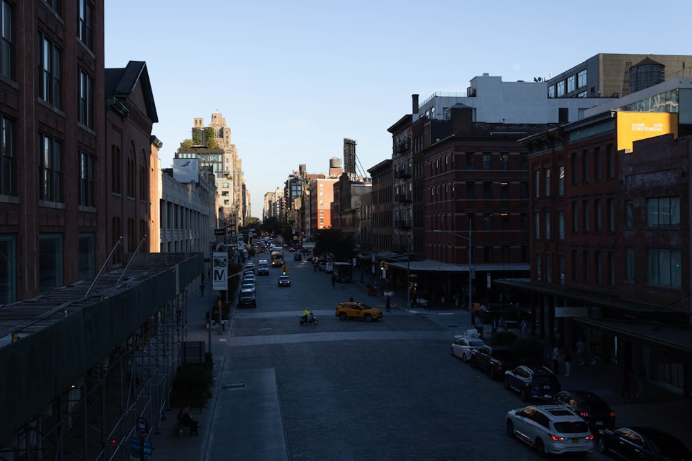 a street with cars and buildings on either side of it