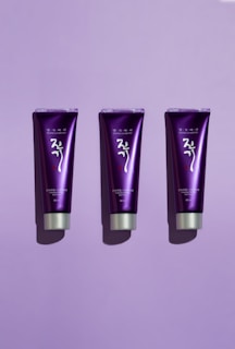 a group of purple and black makeup