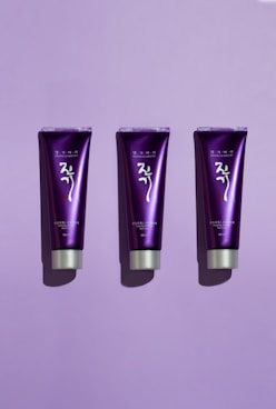 a group of purple and black makeup