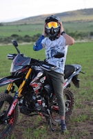 A rider adjusting their helmet before hitting the track.