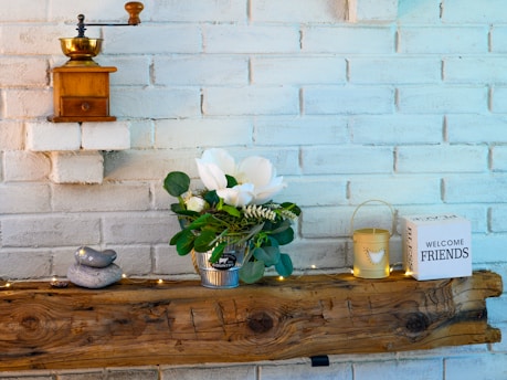a vase of white flowers on a table