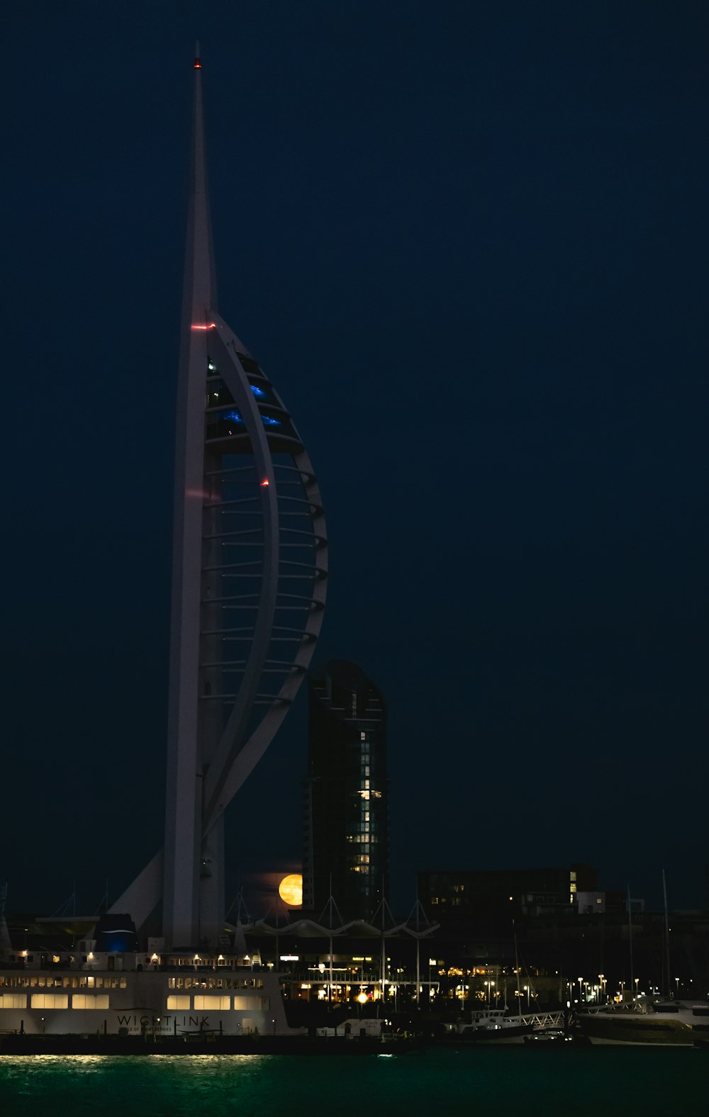 a tall tower with lights at night