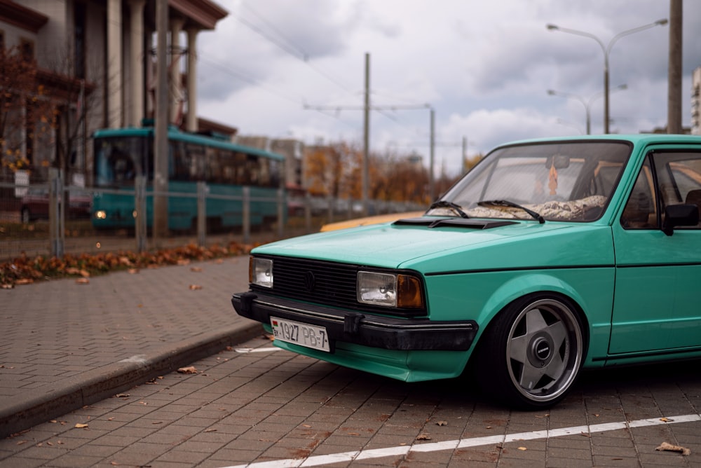 a green car on a road