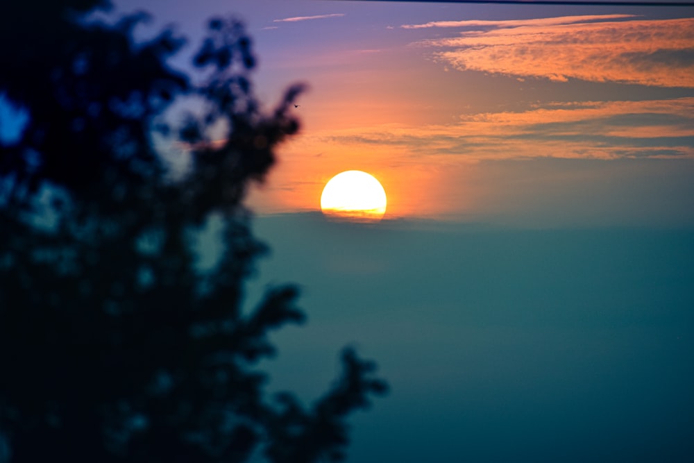 a sunset over a body of water