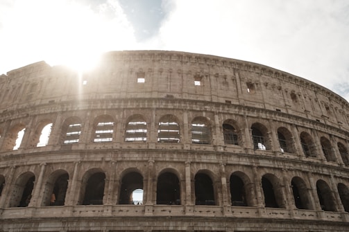 Historic architecture of Rome’s Colosseum bathed in golden afternoon light.