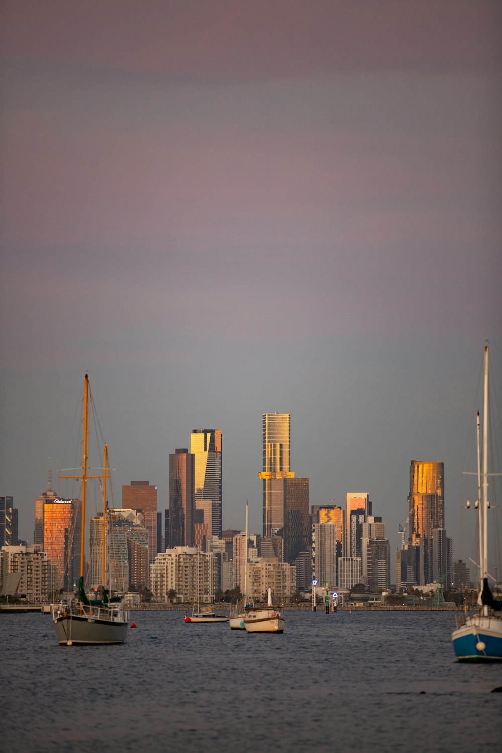 a city skyline with boats