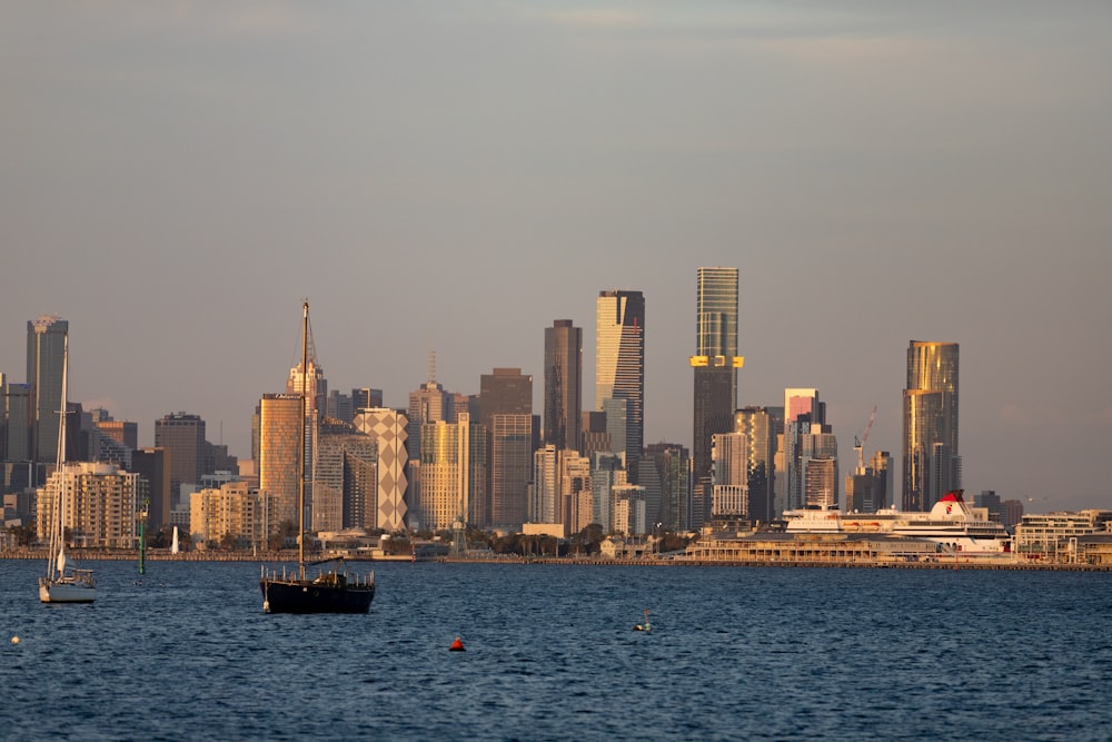 a city skyline with boats