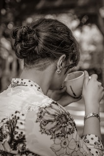 a person drinking from a cup