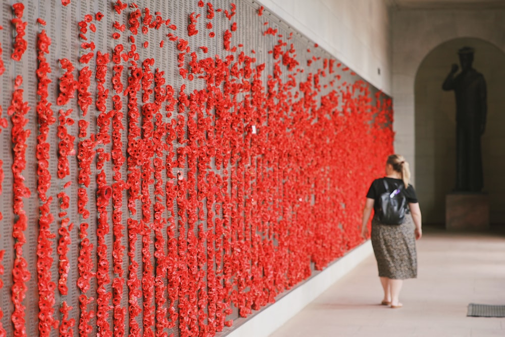 a person looking at a wall of red and white lights