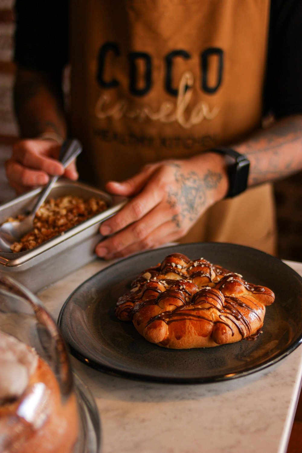 a person holding a sign over a plate of food