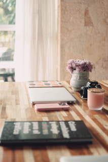 a tablet and a cup of coffee on a table
