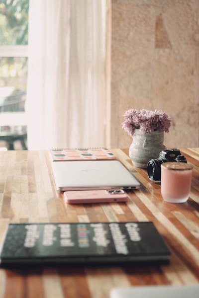 a tablet and a cup of coffee on a table