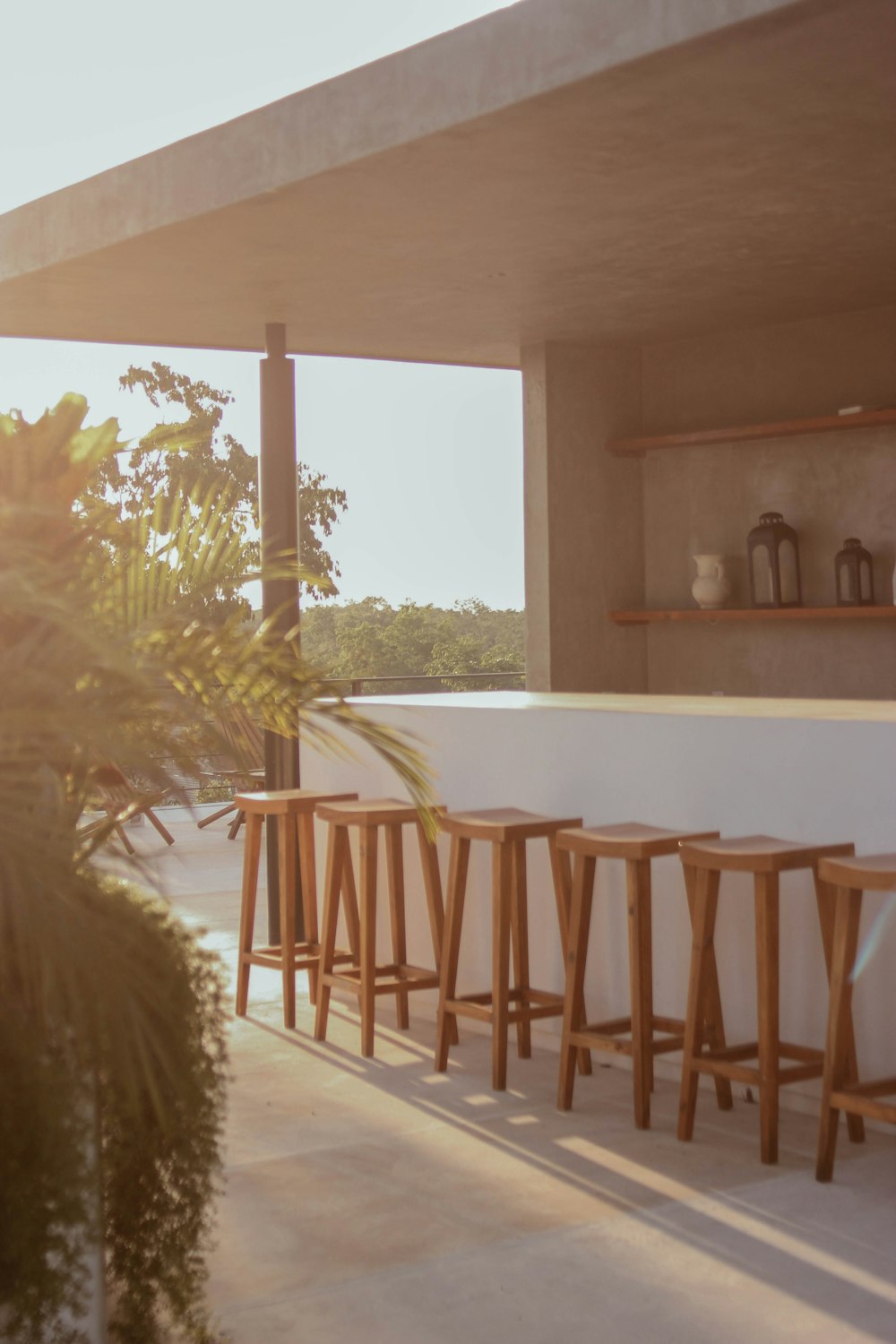 a group of stools in a room with a window