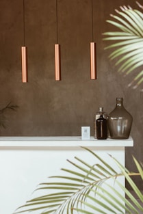 a couple of glass bottles on a shelf