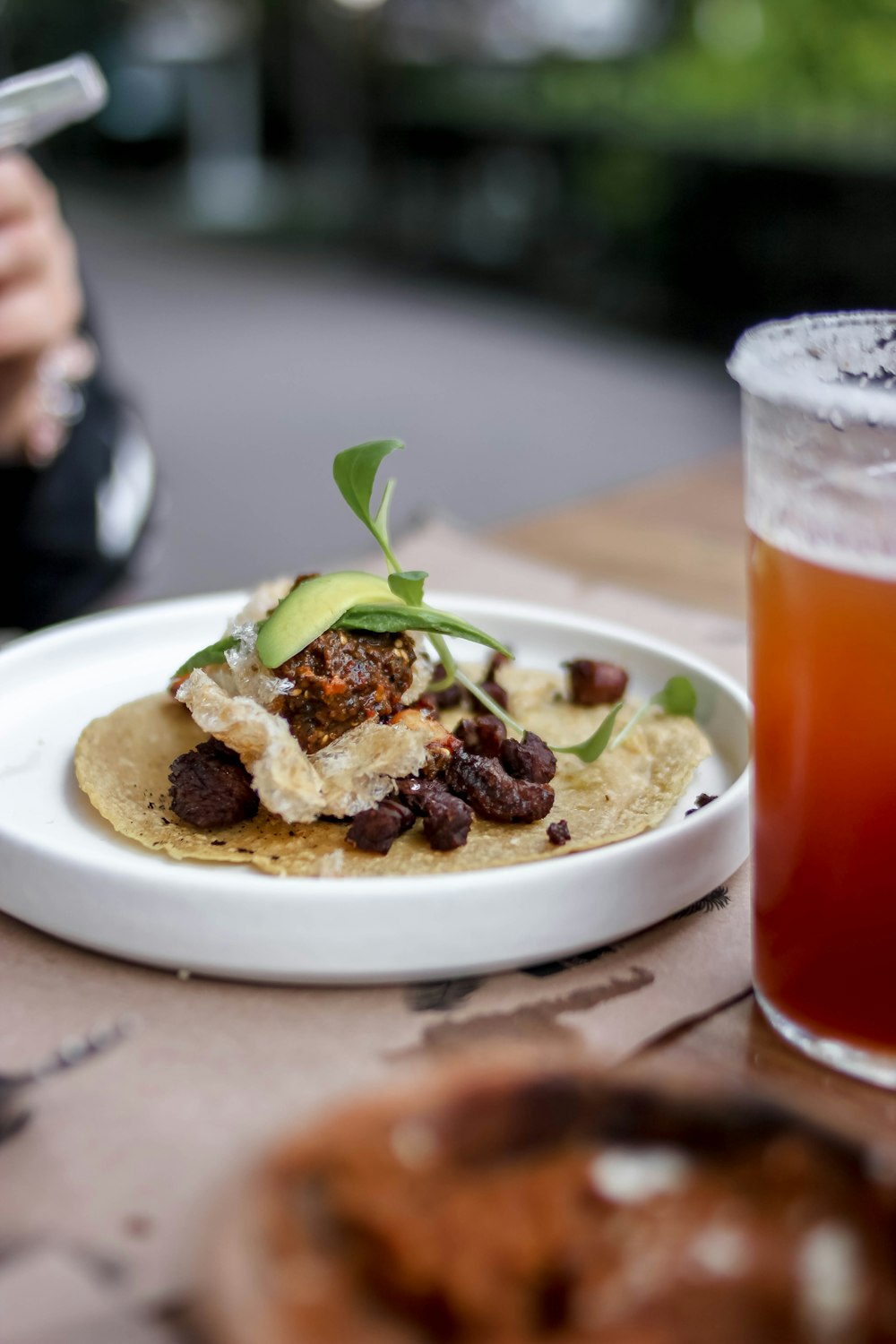 a plate of food and a glass of beer