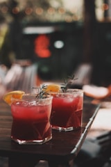 a group of drinks with fruit