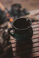 A cozy mug featuring a personalized name and warm colors on a wooden table