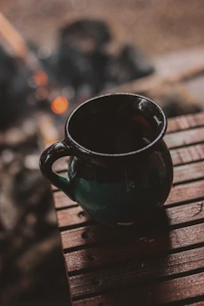 A cozy mug featuring a personalized name and warm colors on a wooden table