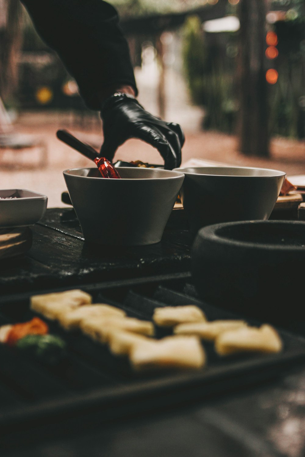 a person cooking food on a grill