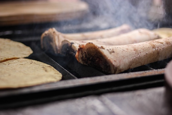 Step-by-step visual of the cochinita pibil preparation process highlighting the marination and cooking stages.