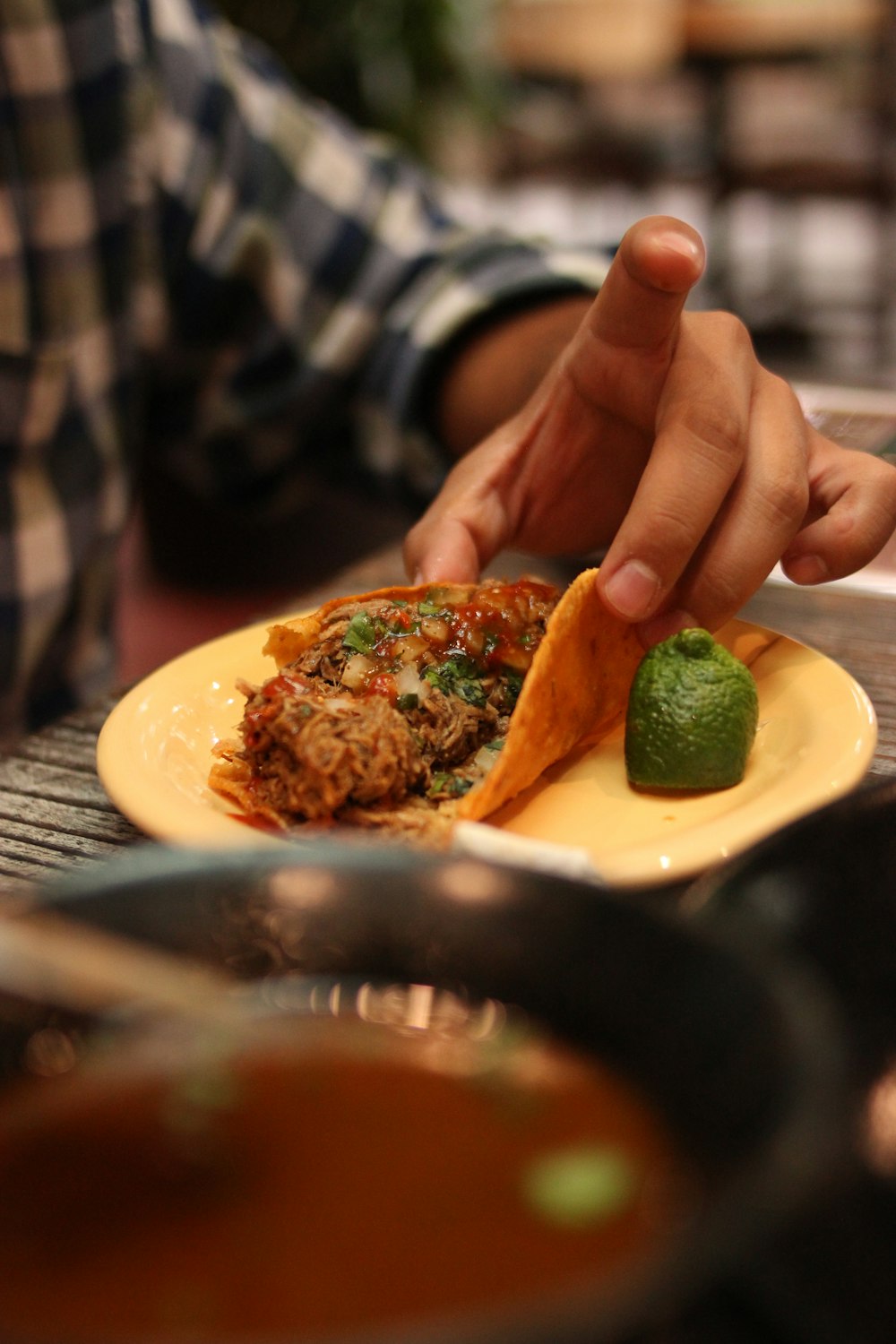 a person holding a plate of food