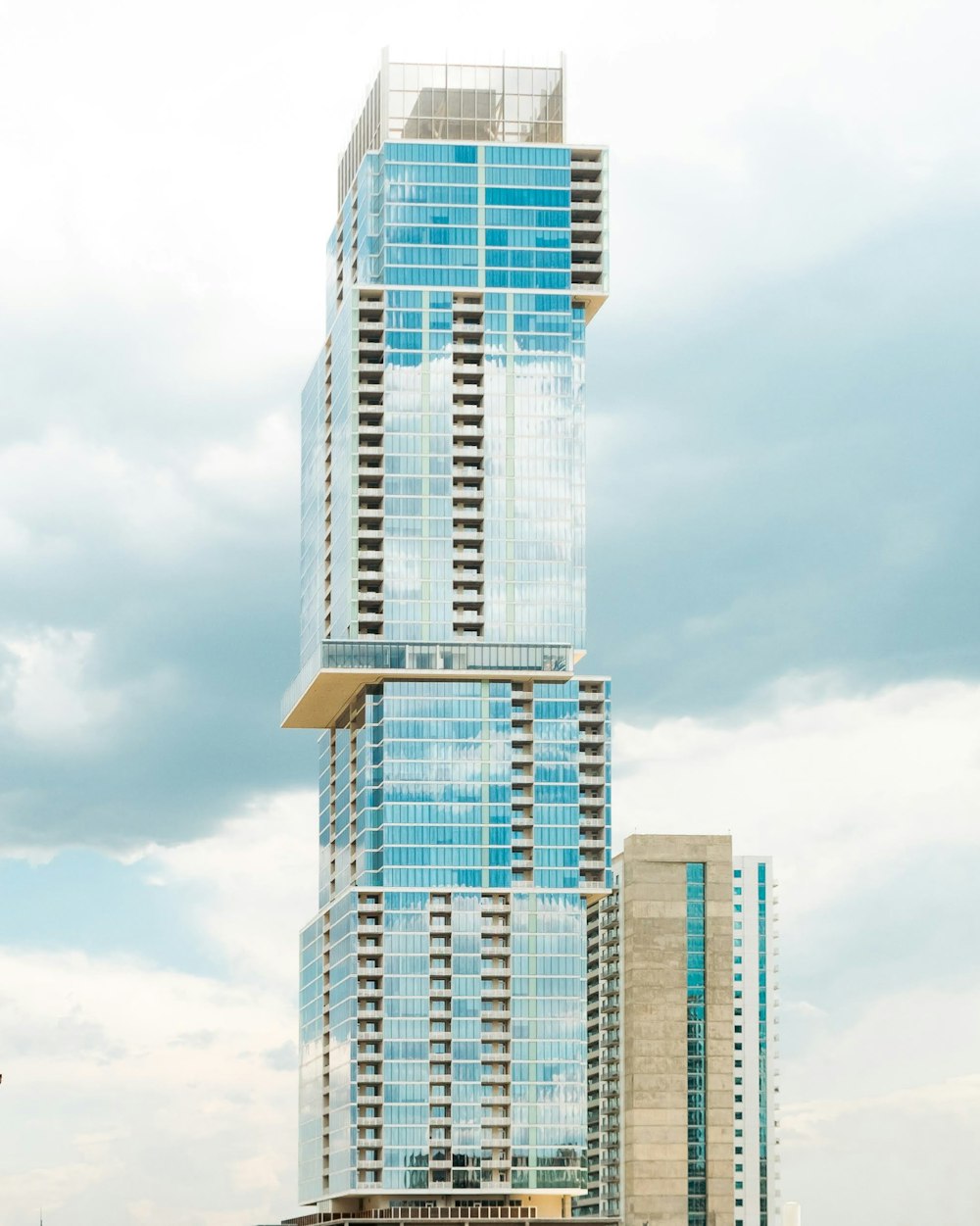 a tall building with a glass front