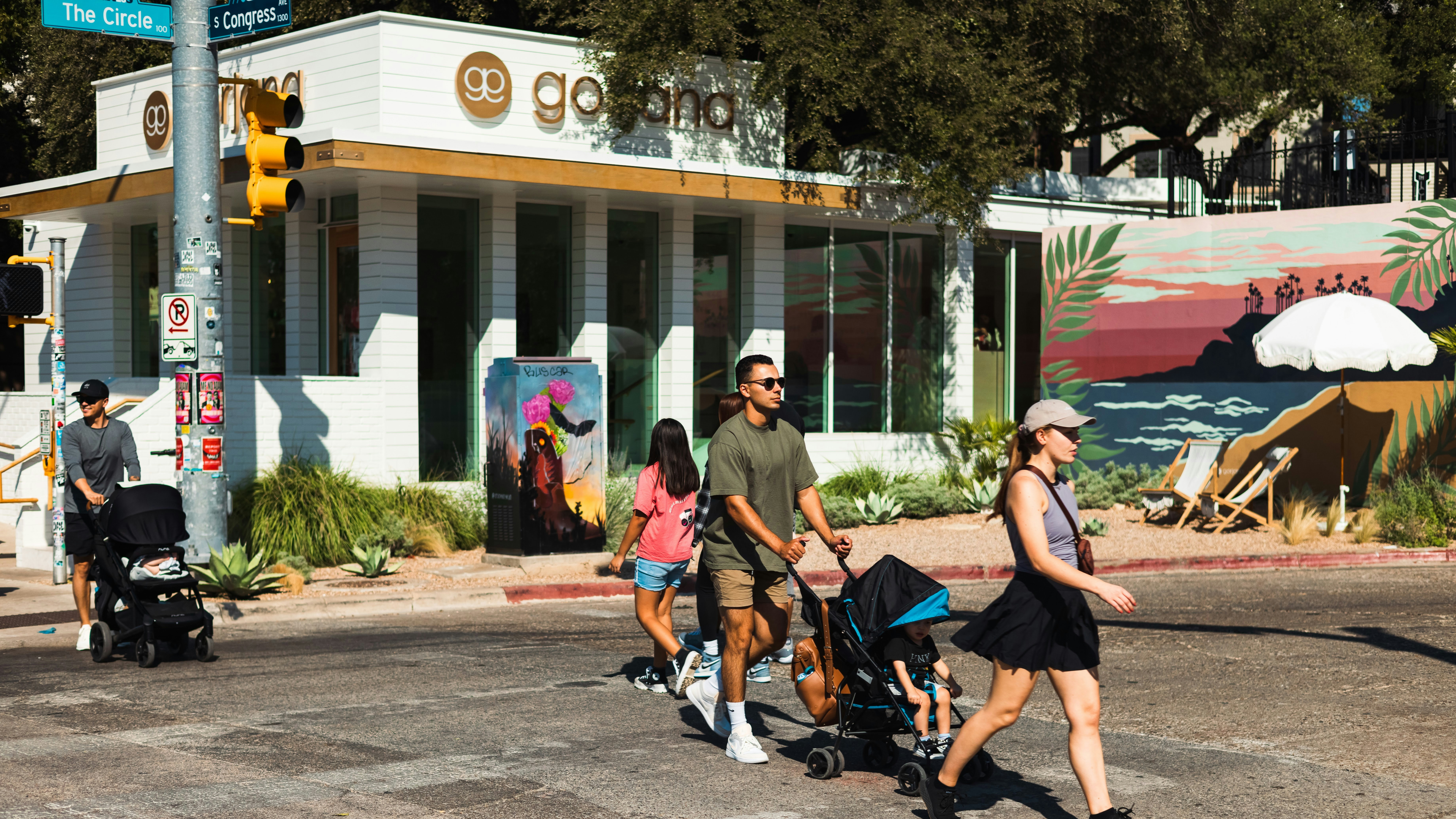 a group of people walking down a street