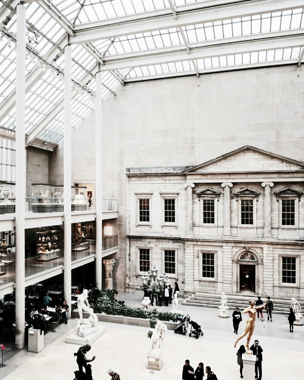 a group of people walking around a building