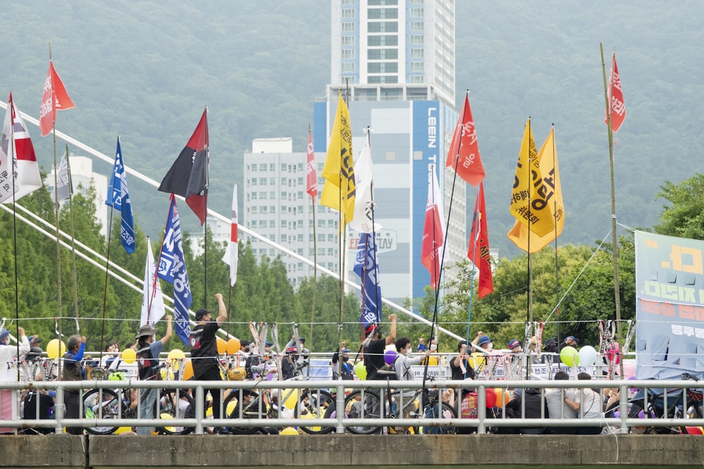 a group of people holding flags